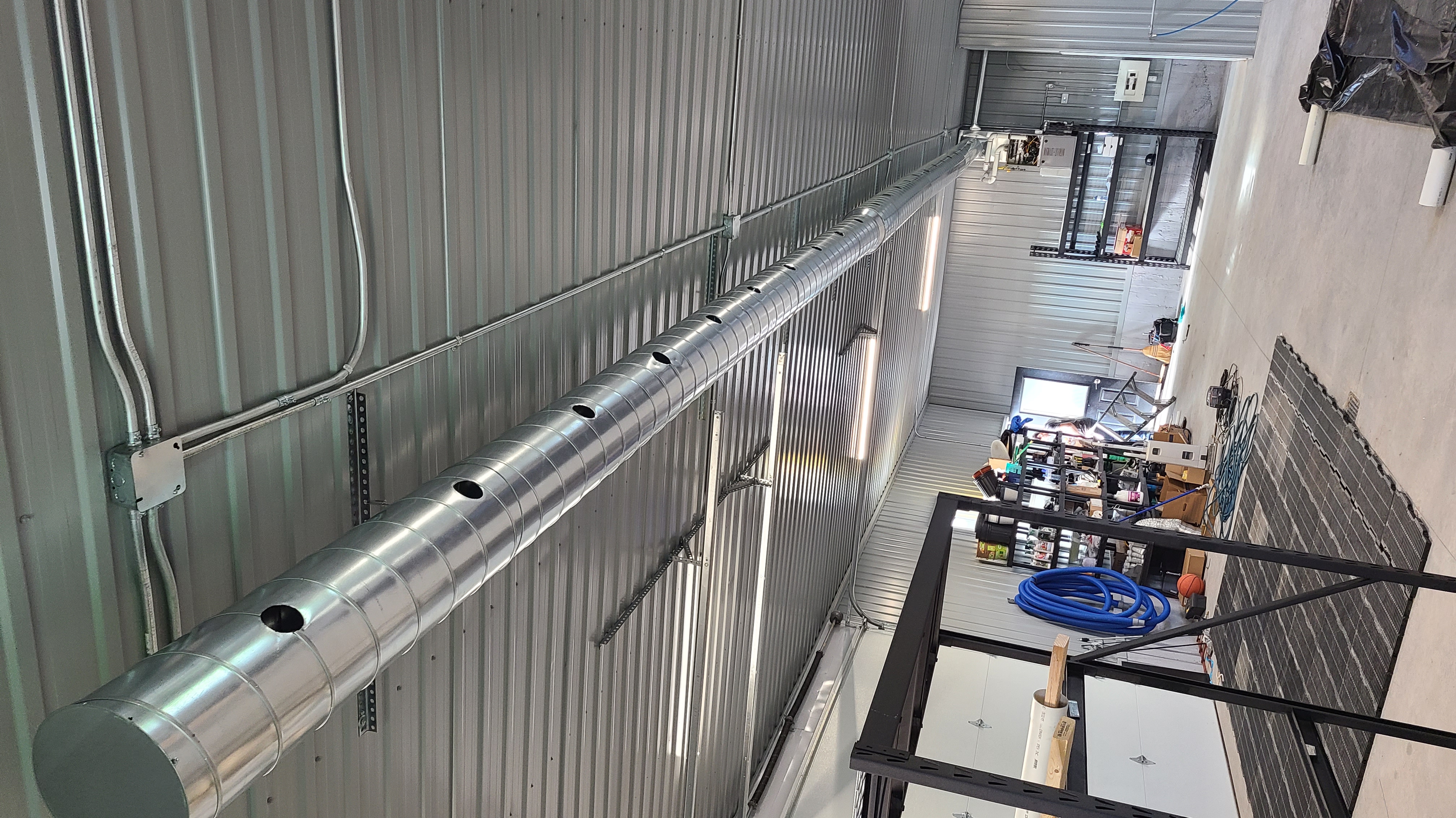 Commercial ductwork installation in a shop